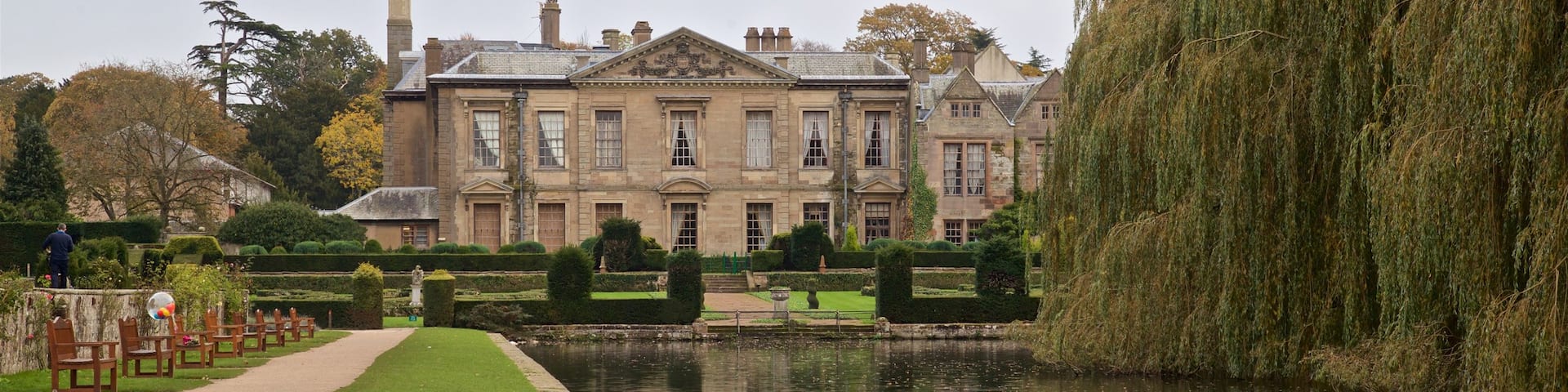 Coombe Abbey Country Park featuring heritage architecture, a pond and bird life