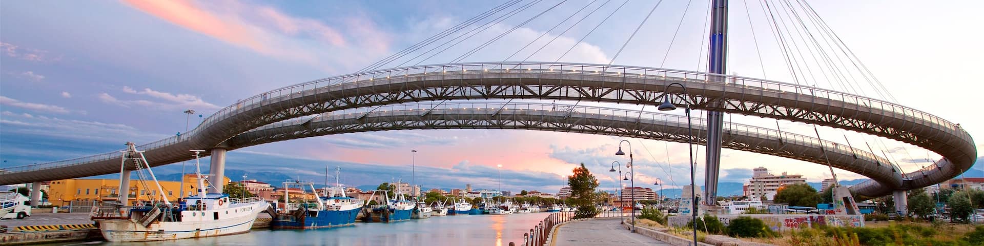 Ponte del Mare showing a bridge, a sunset and a river or creek