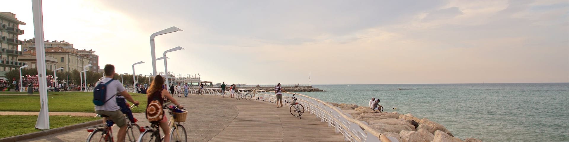 Pesaro which includes a sunset, cycling and general coastal views