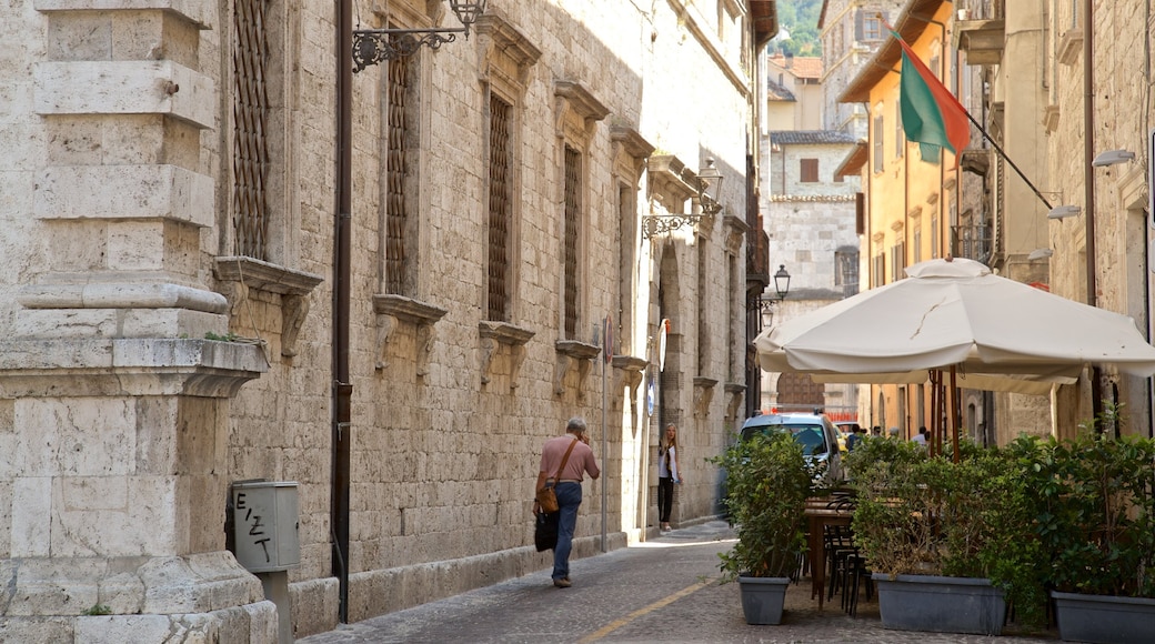 Pinacoteca Civica featuring street scenes as well as an individual male