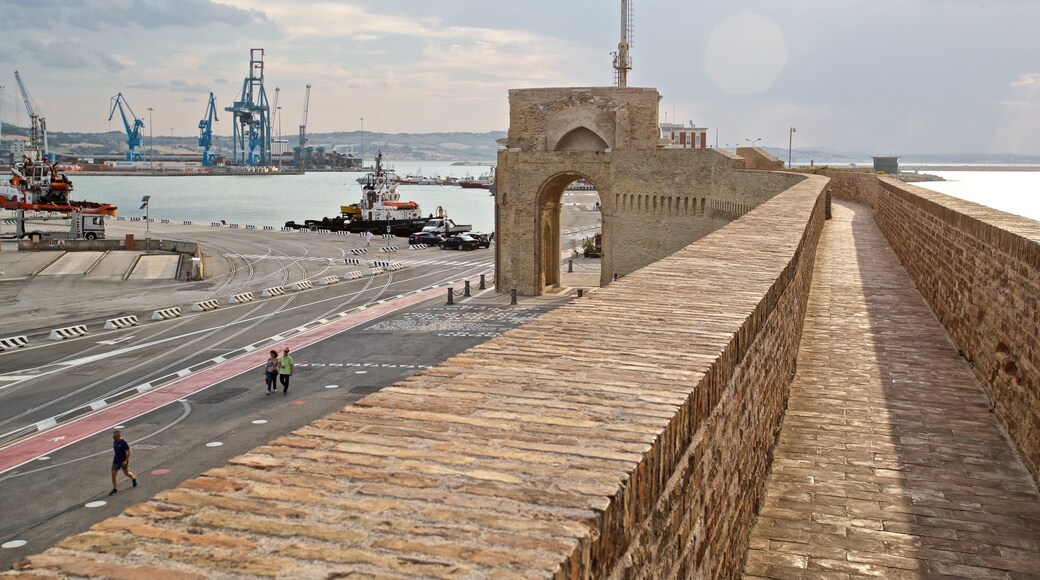 Arco di Traiano featuring a marina and heritage elements