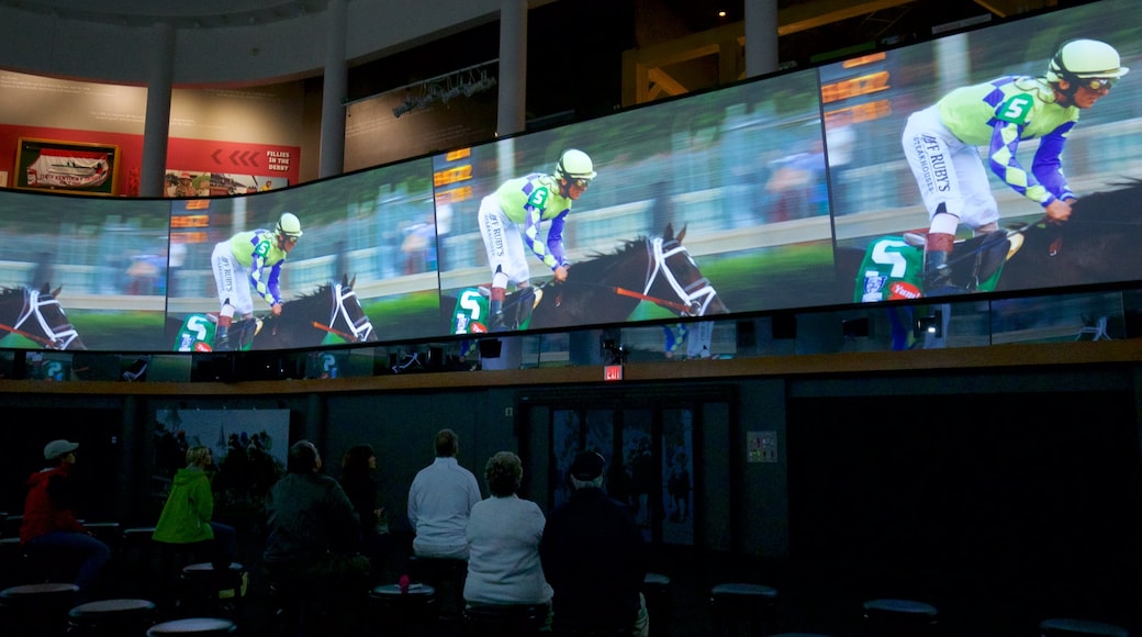 Kentucky Derby Museum featuring interior views as well as a small group of people