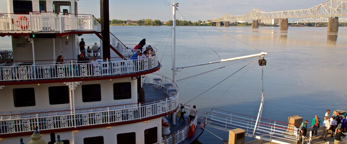 Belle of Louisville featuring a ferry and a bay or harbour as well as a small group of people