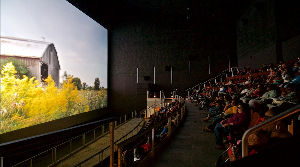 Peoria Riverfront Museum showing interior views and theater scenes as well as a large group of people