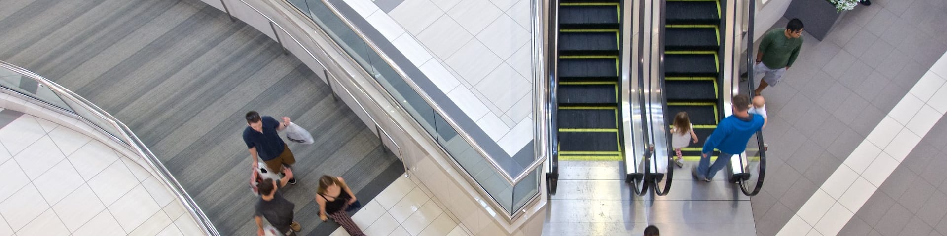 Woodfield Mall which includes shopping as well as a small group of people