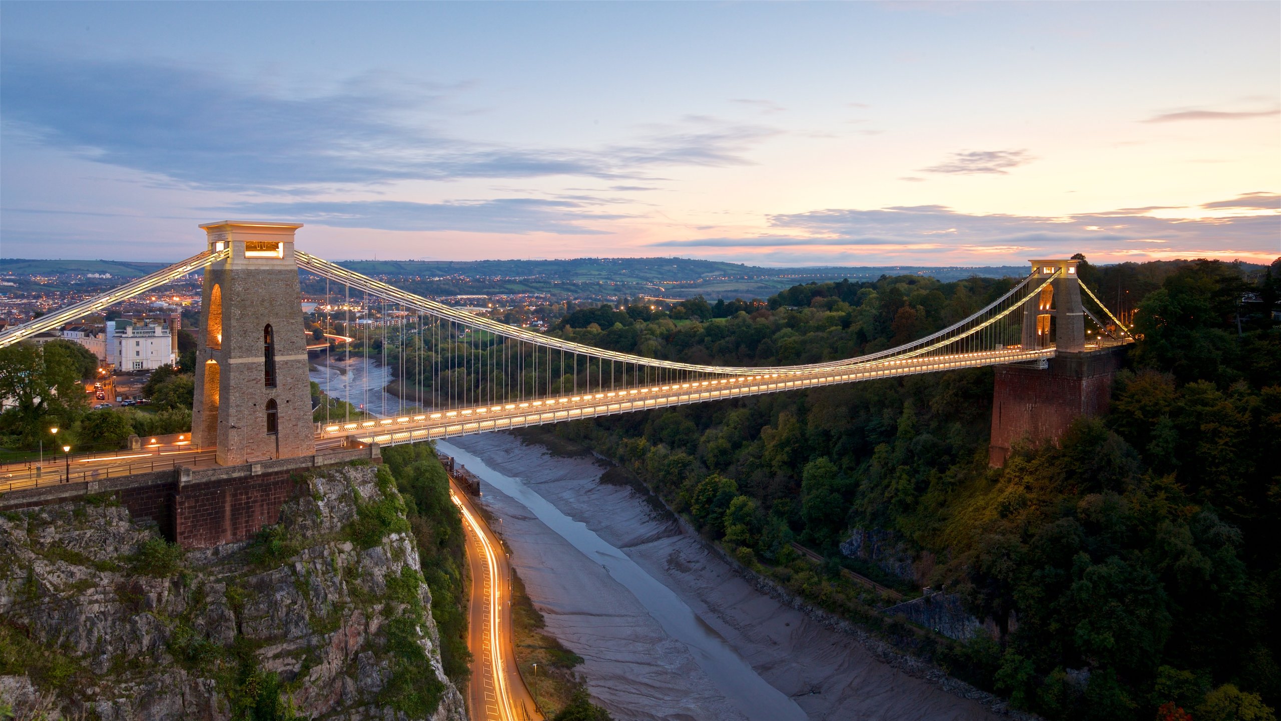 Clifton Suspension Bridge which includes a sunset, a bridge and landscape views