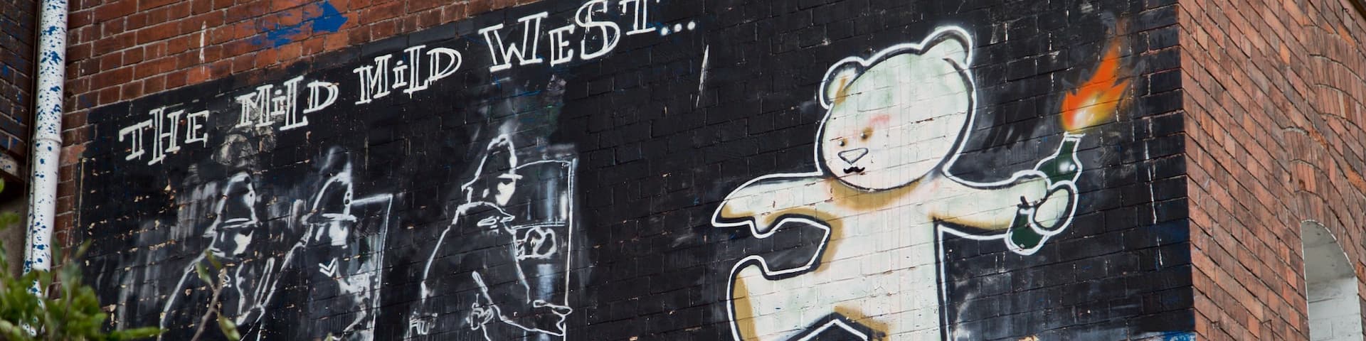 Banksy Graffiti Mild Mild West which includes outdoor art