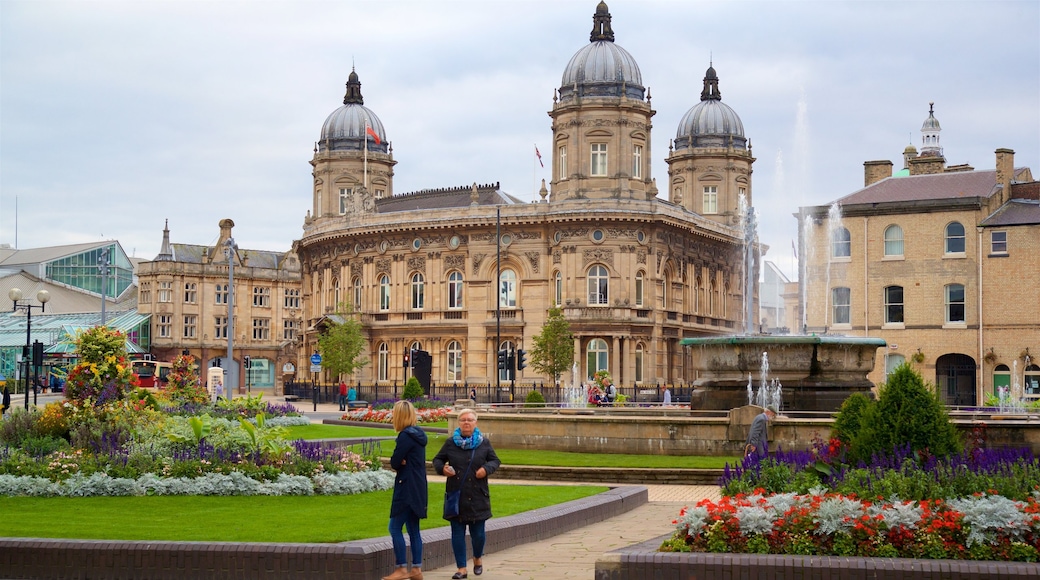 Queen\'s Gardens featuring a fountain, heritage architecture and flowers