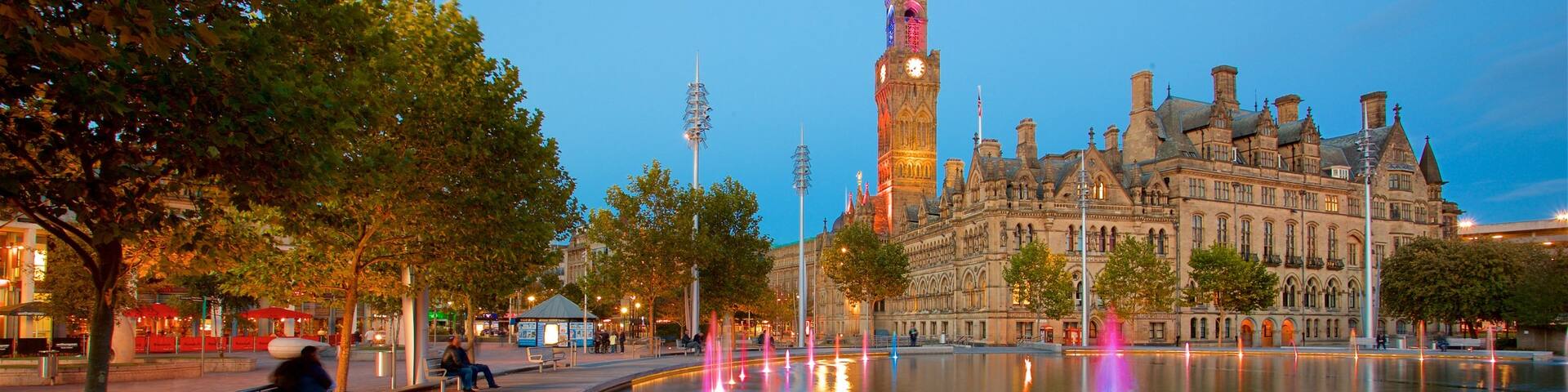 Bradford City Hall featuring a fountain, night scenes and a pond