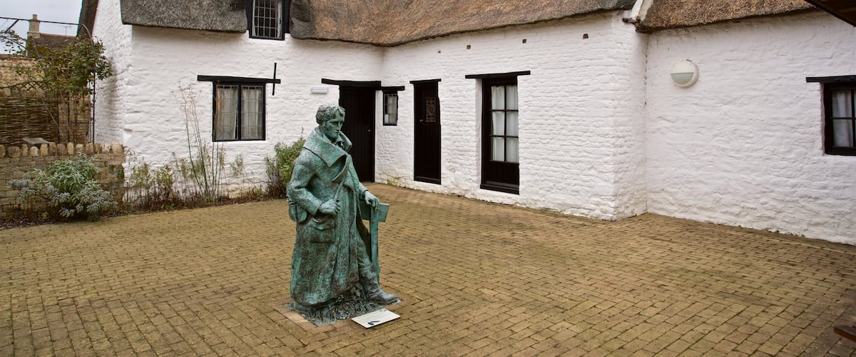 John Clare Cottage showing a house and a statue or sculpture
