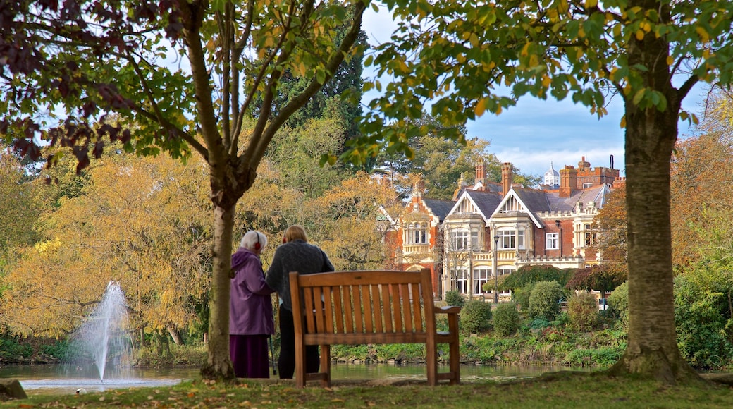 Bletchley Park showing a park and a pond as well as a couple