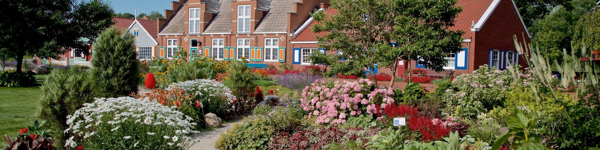 Windmill Island featuring wildflowers and a garden