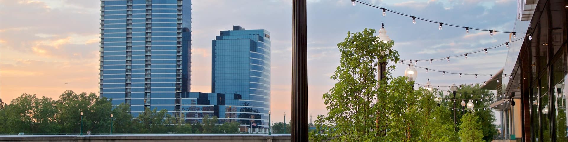 Grand Rapids which includes a sunset, a city and a river or creek