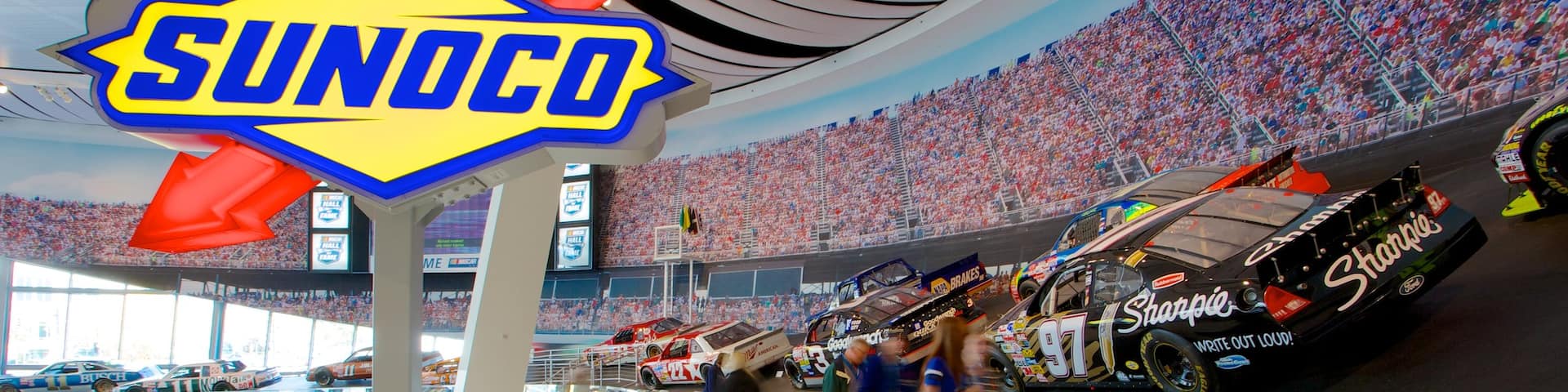 NASCAR Hall of Fame showing interior views as well as a small group of people