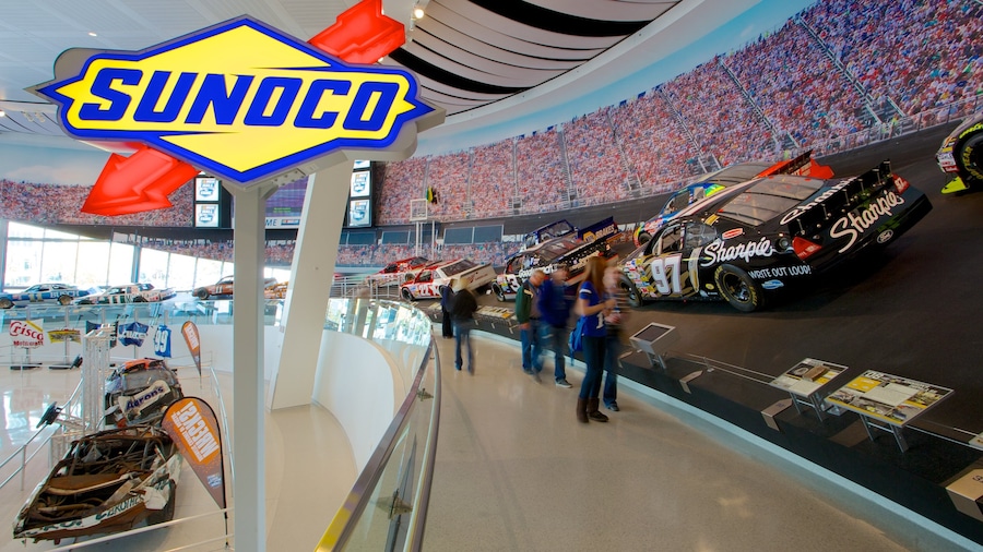 Interior view of NASCAR Hall of Fame featuring iconic race cars and museum exhibits in Charlotte, North Carolina.