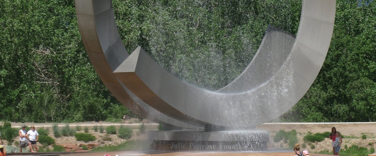 Colorado Springs which includes a fountain, outdoor art and a park