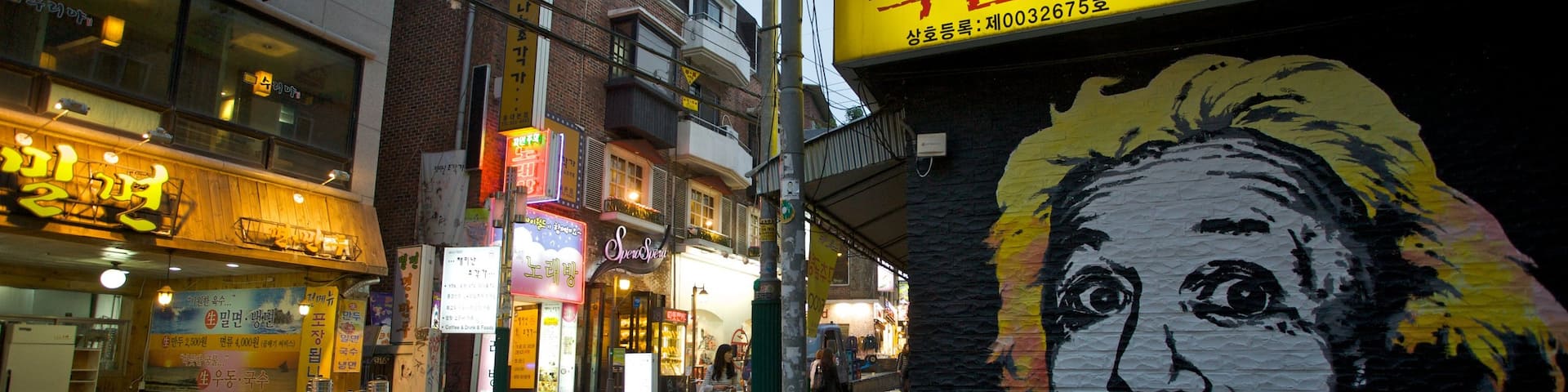 Hongdae which includes street scenes, outdoor art and signage