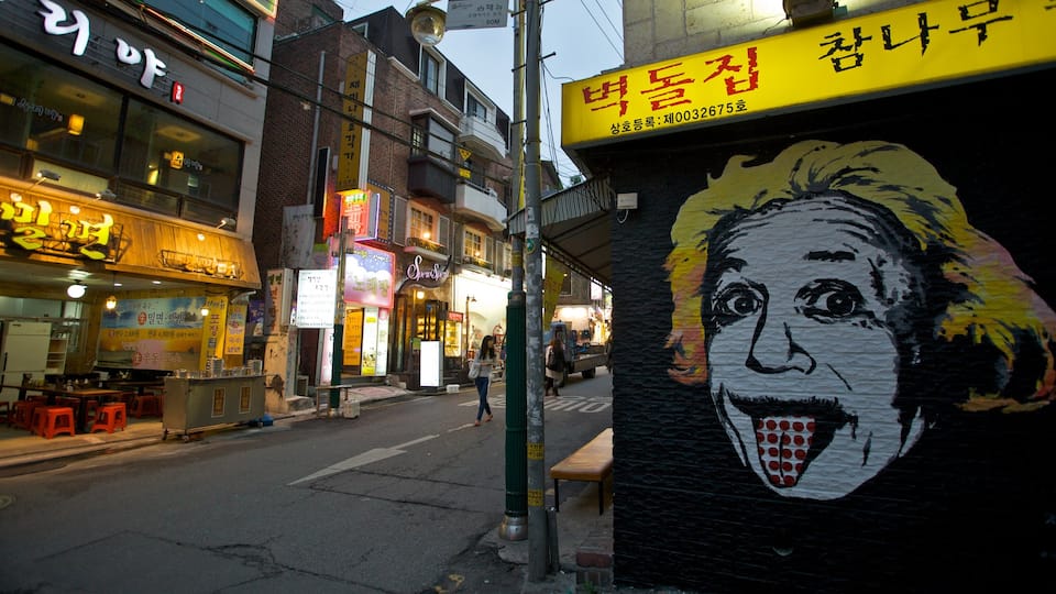 Hongdae which includes street scenes, outdoor art and signage