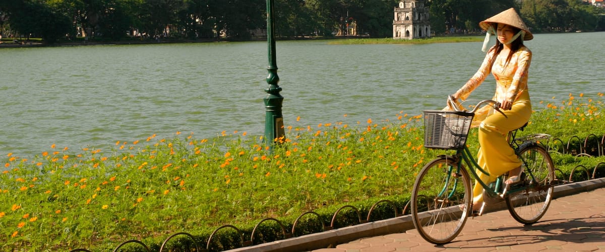 Hanoi showing cycling as well as an individual femail