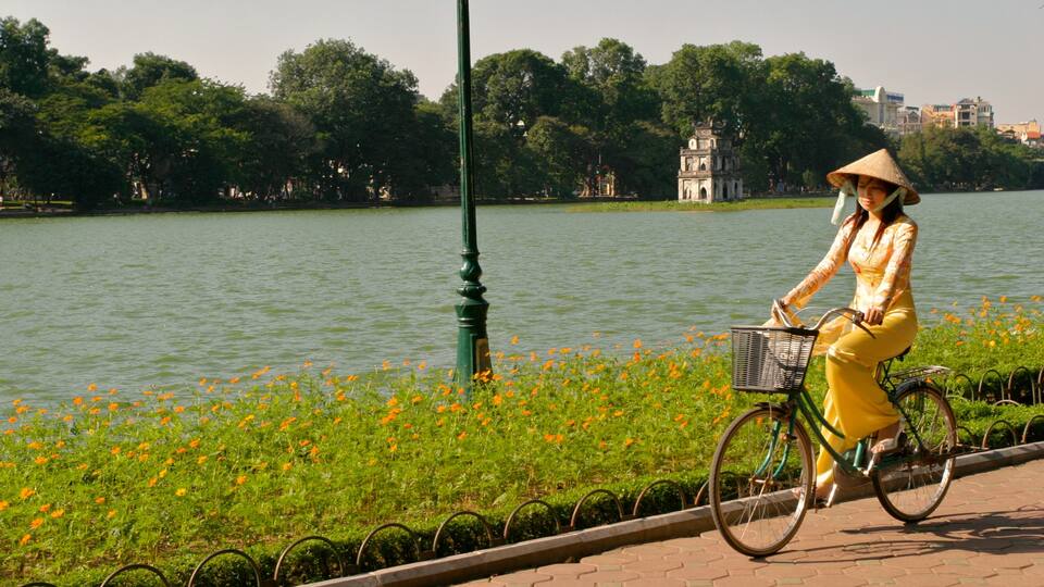 Hanoi showing cycling as well as an individual femail