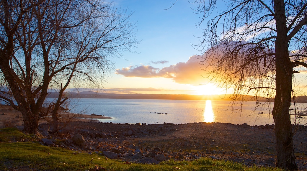 Folsom Lake State Recreation Area which includes a sunset, a lake or waterhole and landscape views