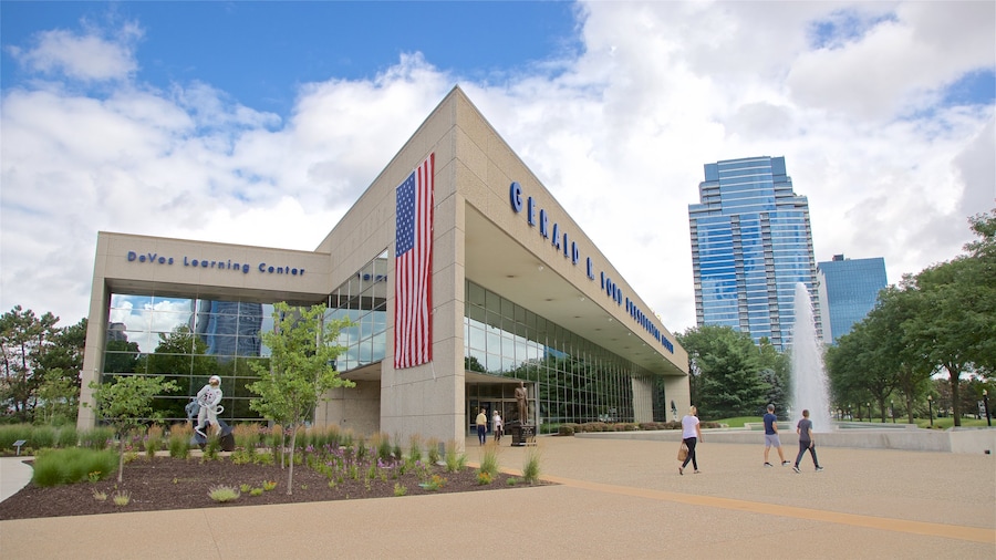 Gerald R. Ford Museum featuring a fountain and street scenes as well as a small group of people