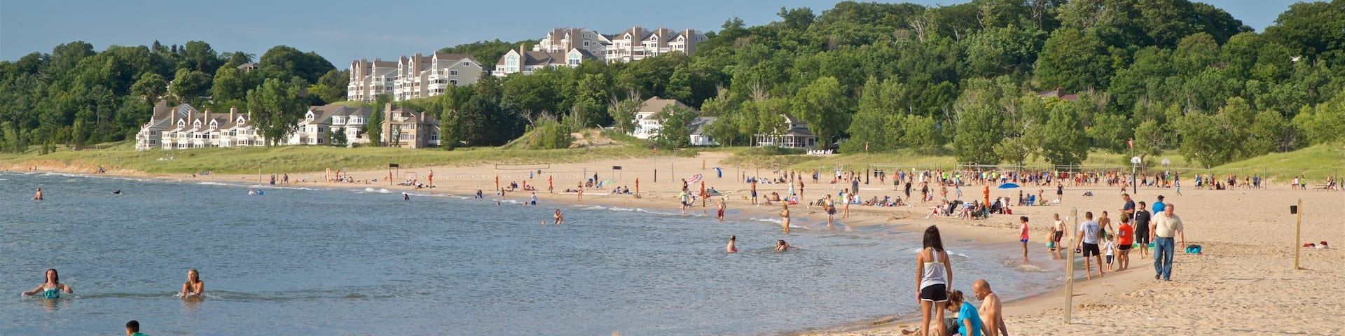 Holland State Park which includes a beach and general coastal views as well as a large group of people