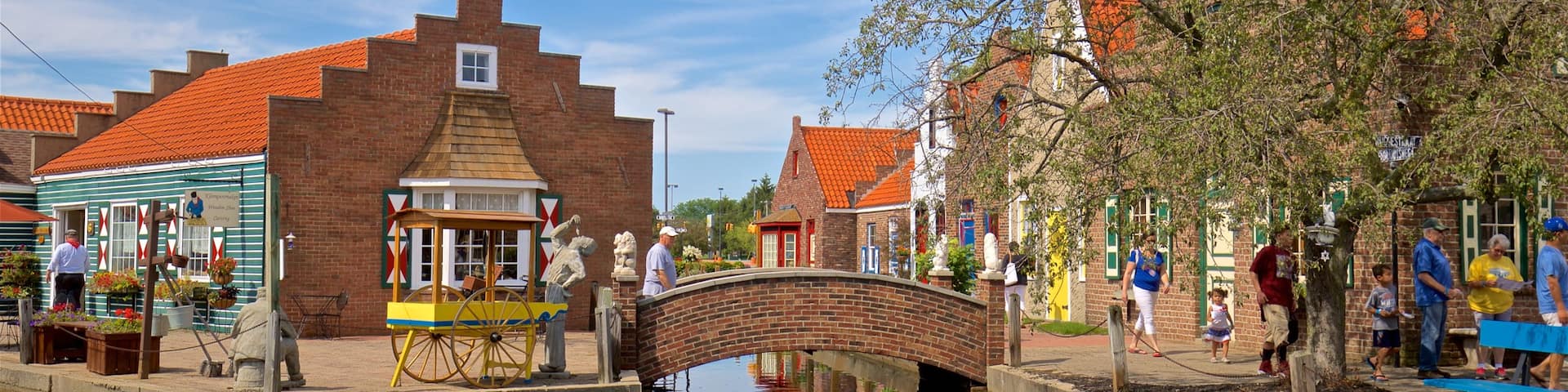 Dutch Village showing a river or creek, a bridge and a small town or village