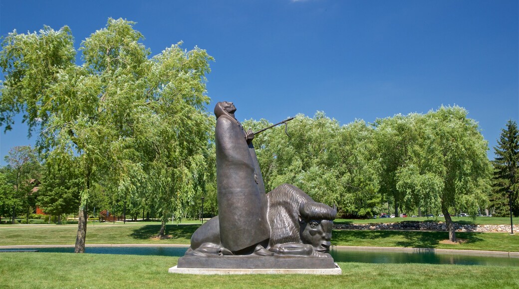 Marshall M. Fredericks Sculpture Museum featuring a garden and outdoor art