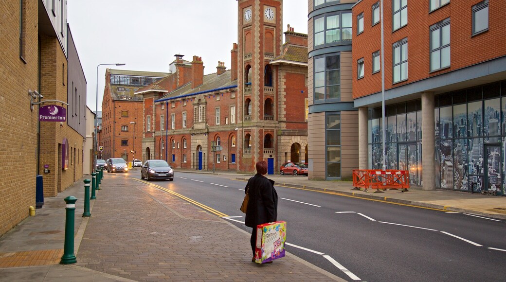 Custom House featuring street scenes as well as an individual female