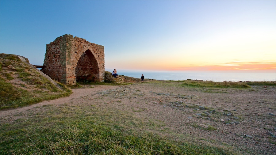 Grosnez Castle which includes landscape views, building ruins and general coastal views
