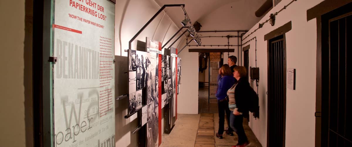 Jersey War Tunnels - German Underground Hospital featuring interior views as well as a small group of people