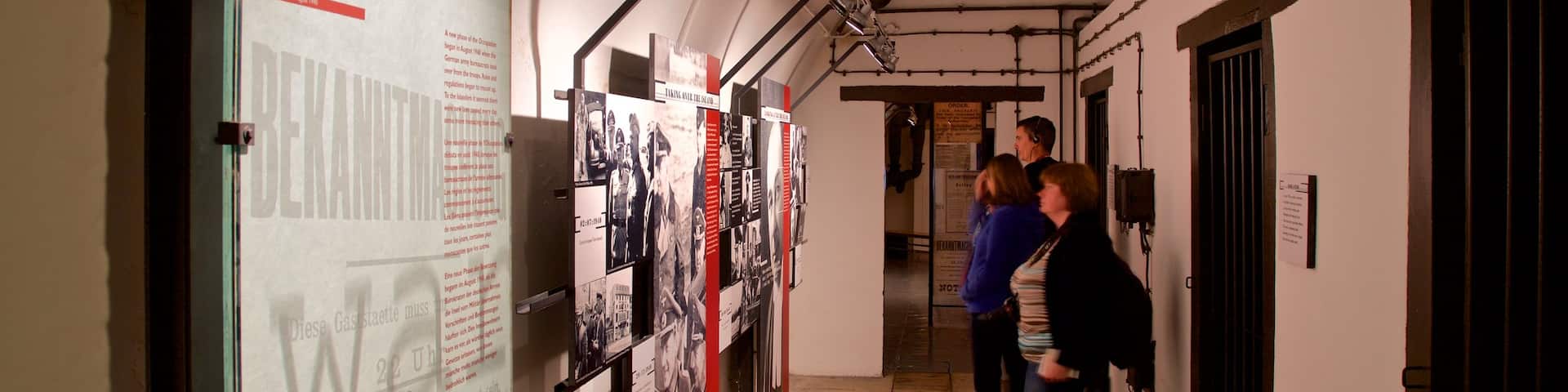 Jersey War Tunnels - German Underground Hospital featuring interior views as well as a small group of people