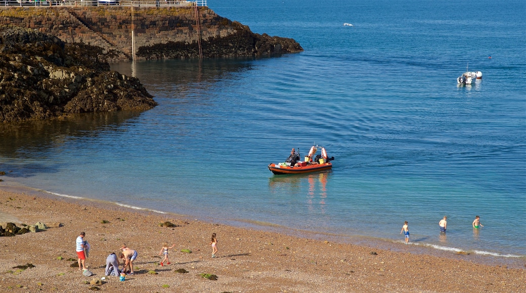 Bouley Bay showing general coastal views, a pebble beach and boating