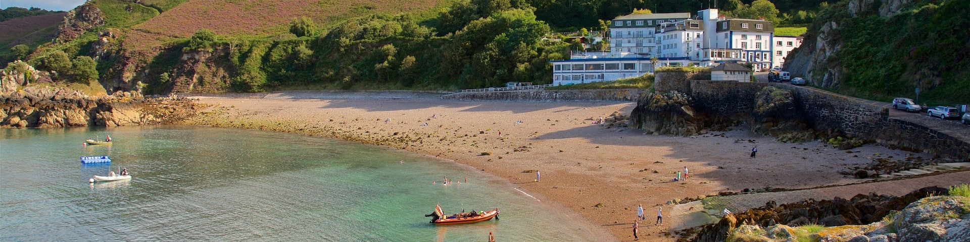 Bouley Bay which includes a beach, general coastal views and rocky coastline