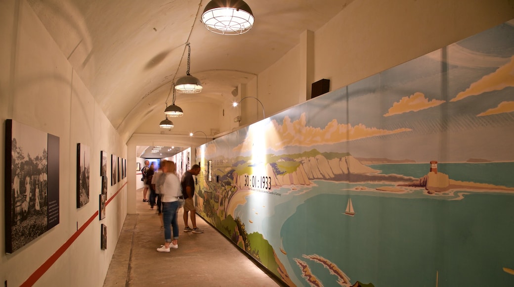 Jersey War Tunnels - German Underground Hospital featuring interior views as well as a small group of people