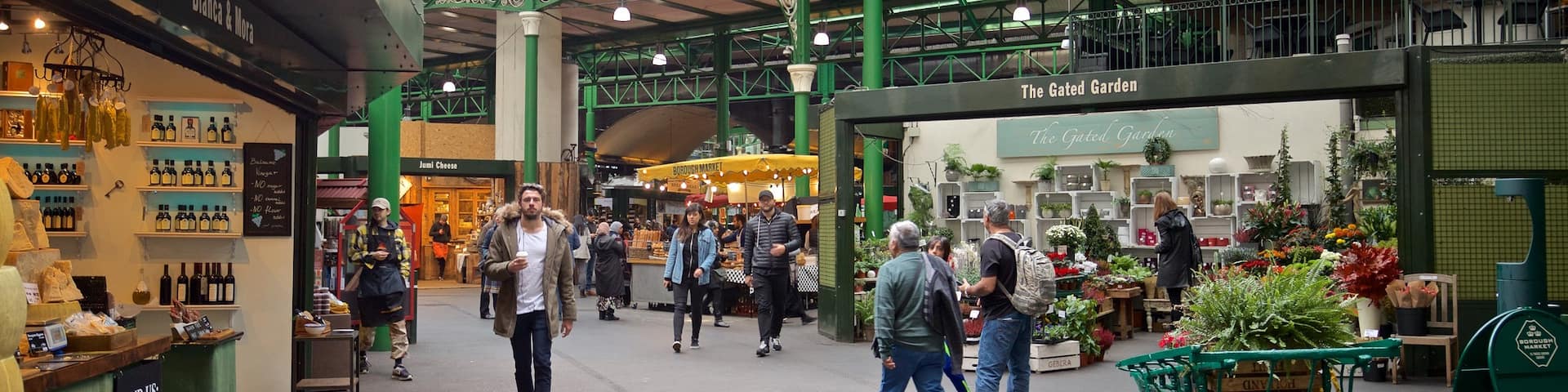 Borough Market featuring markets and street scenes as well as an individual male