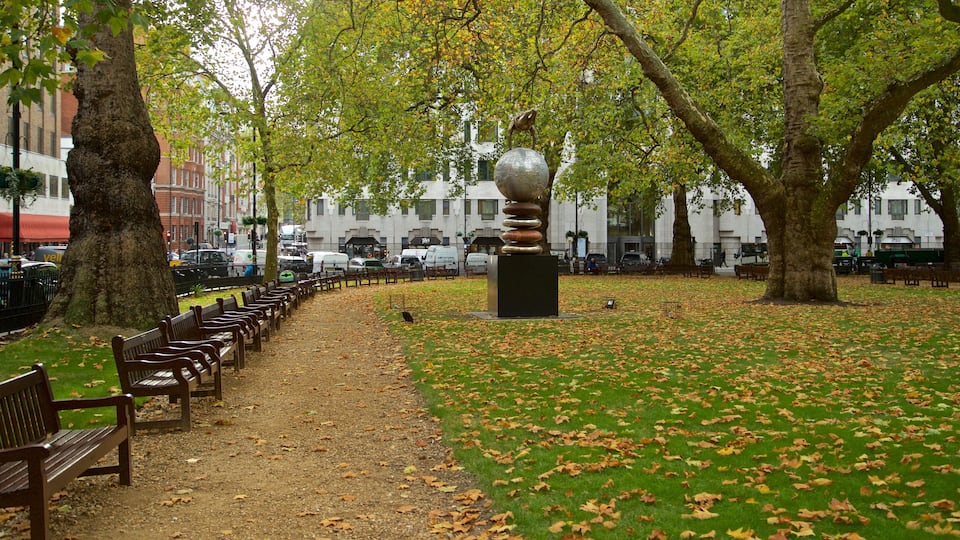 Berkeley Square featuring fall colors, outdoor art and a park