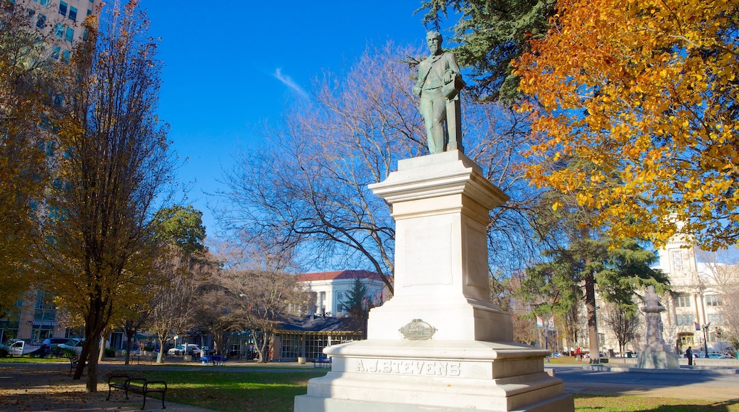 Cesar Chavez Park showing a city, outdoor art and a garden