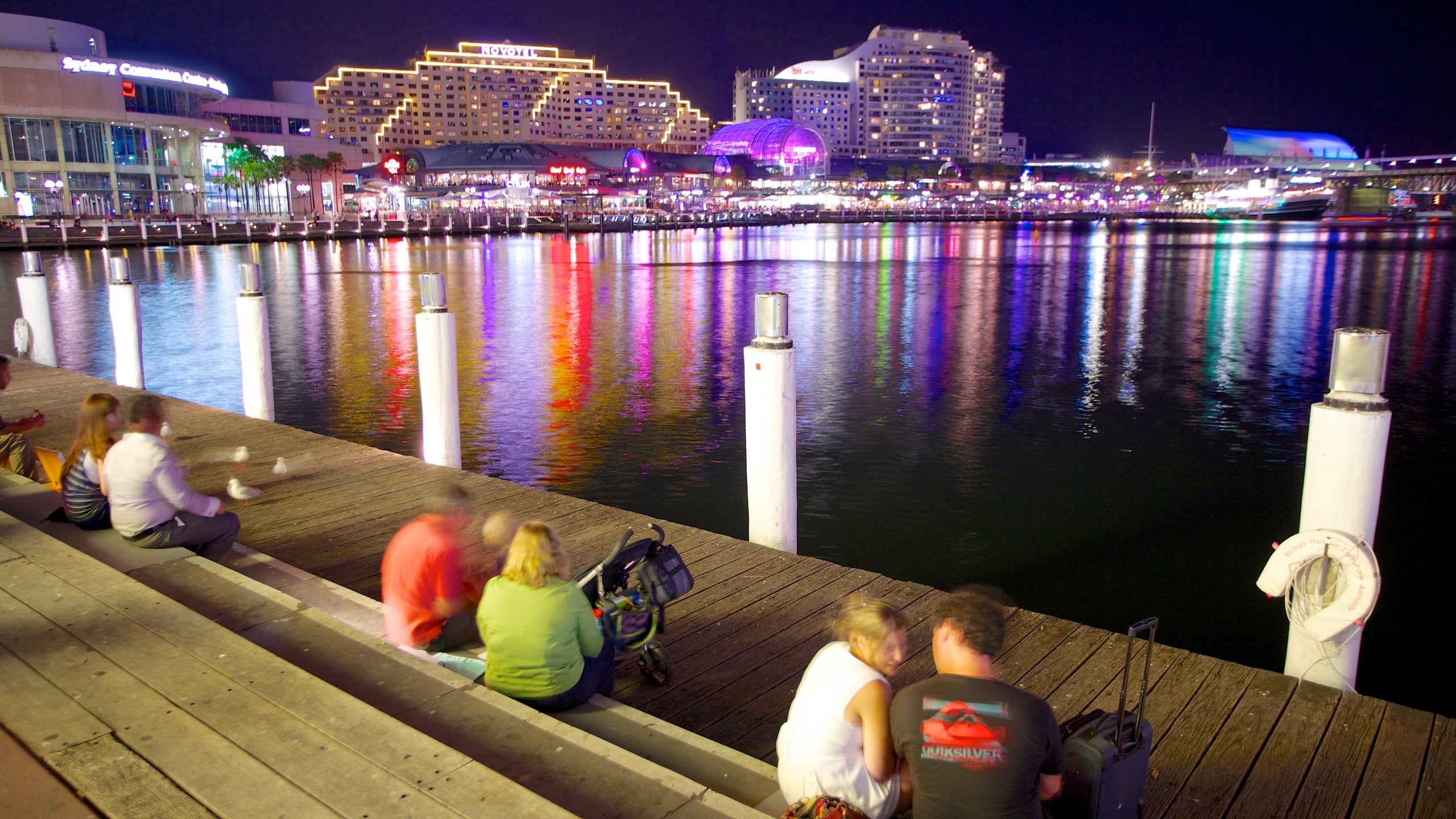 Darling Harbour showing a bay or harbor, night scenes and a city
