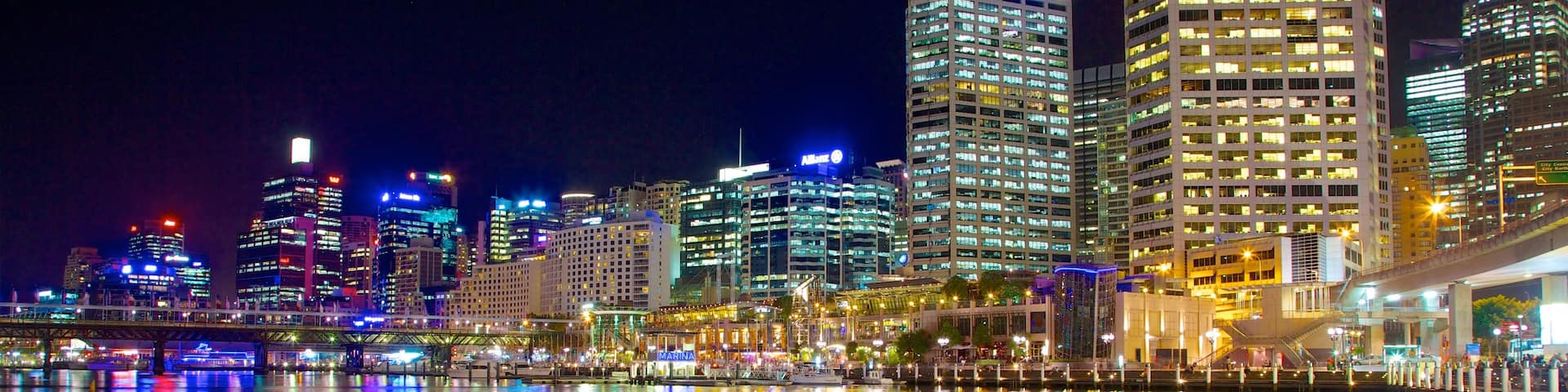 Darling Harbour which includes central business district, night scenes and a bay or harbor