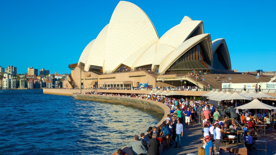 Sydney Opera House which includes a city, street scenes and modern architecture