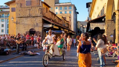 Ponte Vecchio which includes a city, street scenes and street performance