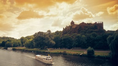 Halle an der Saale which includes heritage architecture, boating and a sunset