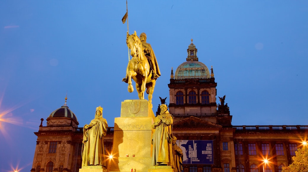 Wenceslas Square which includes a statue or sculpture, night scenes and heritage architecture