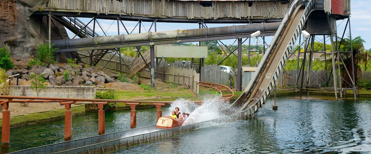 Rainbow\'s End showing rides and a water park as well as a family