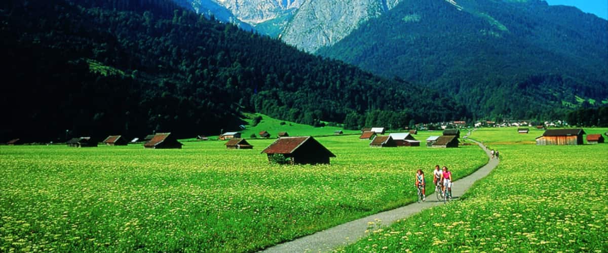Garmisch-Partenkirchen showing mountains, a small town or village and road cycling