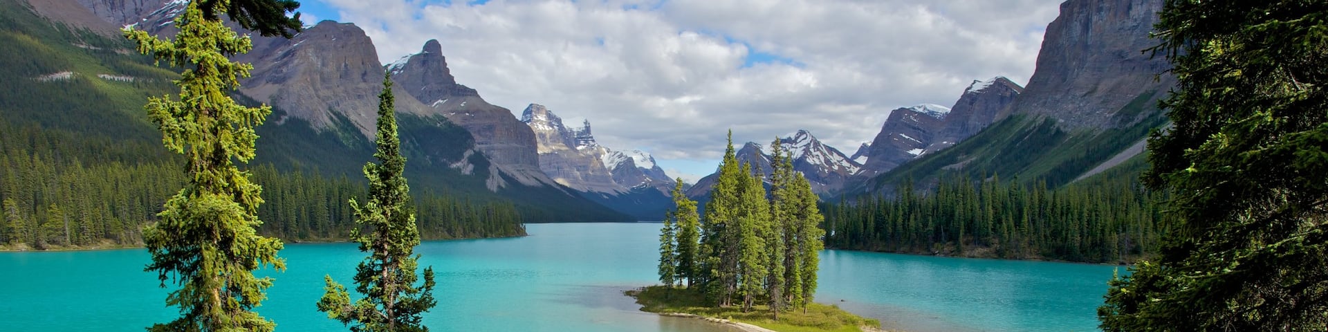 Maligne Lake featuring a lake or waterhole and landscape views