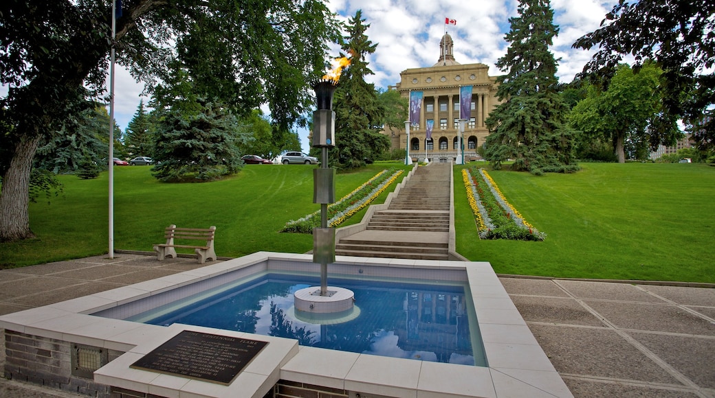 Edificio de la Legislatura de Alberta ofreciendo arte al aire libre, una fuente y un jardín