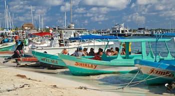 Norte Beach featuring a bay or harbour as well as a small group of people